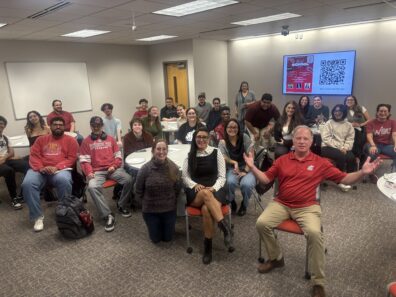 Grad students sitting in a room for a meeting