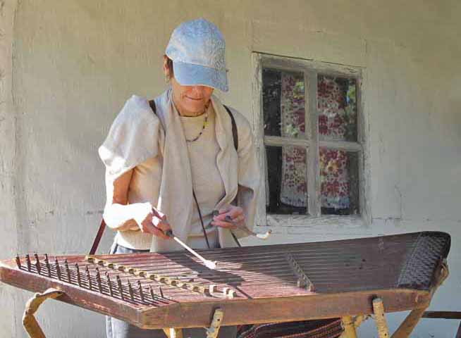 Paula playing the cembalom. 