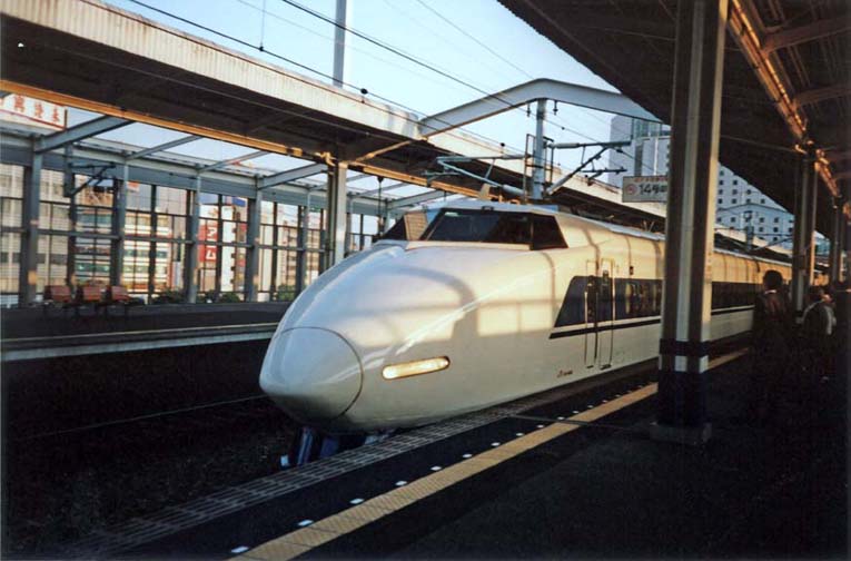 JAPAN: May 13: We landed in Osaka at Kansai Airport and found our train to Kyoto with little trouble. Although we were not at first aware of it, this was to be our first experience with the luxurious shinkansen or “new trunk line” trains which Westerners call “bullet trains.” They fly along on continuously welded steel rails at speeds up to and beyond 200 miles per hour. The seats are large and comfortable, food is always available (mostly boxed bento lunches), seats are reserved, no-smoking cars are provided, and the conductors bow politely to the passengers of each car as they leave it.