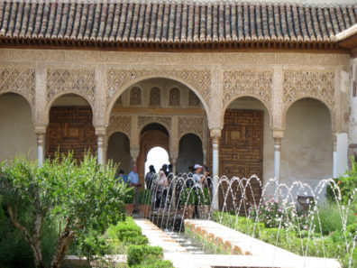Welcome to Spain: Showing detailed ornamentation of the arches at one end of this famed patio.