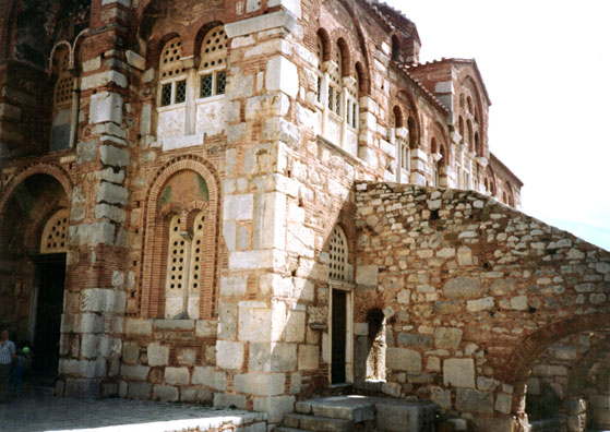 OSSIOS LOUKOS: On May 27 we visited the Medieval Greek Orthodox church of Ossios Loukos. There are three sanctuaries: an older church to the left, the main church at ground level, and the crypt underneath. The women in the group had to don skirts and cover their arms to be admitted. Catherine had brought a wrap along for just this contingency and loaned it out in turns. The gift shop offered both icons of the Virgin and sculptures of pagan deities.