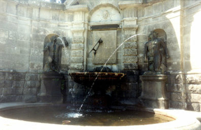 POWERSCOURT: Another of the elaborate fountains at Powerscourt, with a sundial at its center.