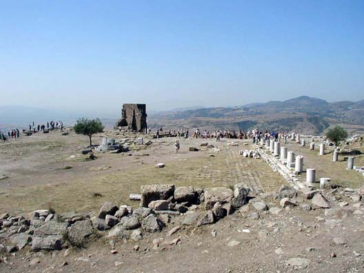 PERGAMUM ACEOPOLIS: The most famous building in ancient Pergamon/Pergamum was its library. So many distinguished scholars gathered here that the Egyptian scholars in charge of the great library at Alexandria feared a "brain drain" and decreed a ban on papyrus exports to Pergamum. The scholars here devised a method of writing on animal skins that spread throughout Europe and became known as "parchment"--meaning "from Pergamum." Not much is left of the library today.