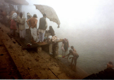 Worshipers bathing in the holy Ganges on a foggy winter morning.