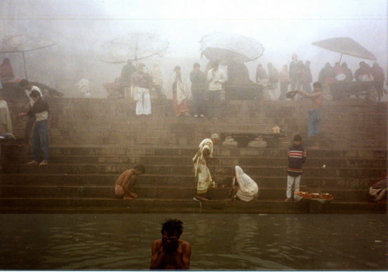 We saw some more bathers as our boat made its way along the ghats in a mist so thick we couldn't make out the tops of the buildings on shore. A water-borne huckster clung to our boat and tried to sell us souvenirs.
