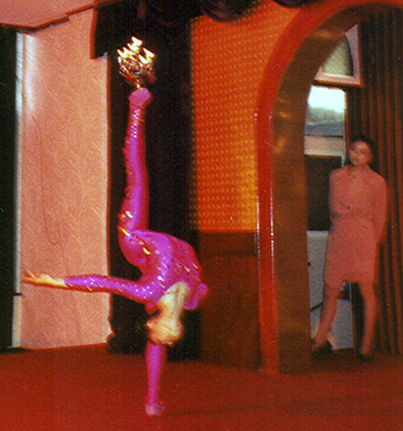 SHANXI: This was followed by traditional Chinese acrobatics. Here a contortionist balances flaming lamps on her feet. Eventually she held five of them.