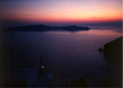 SANTORINI: We then flew to the island of Santorini (known in ancient times as Thera). Across the road from our hotel we looked down into the submerged caldera of the ancient volcano which may have given rise to the legend of Atlantis. You can go swimming in the warm waters heated by the caldera.