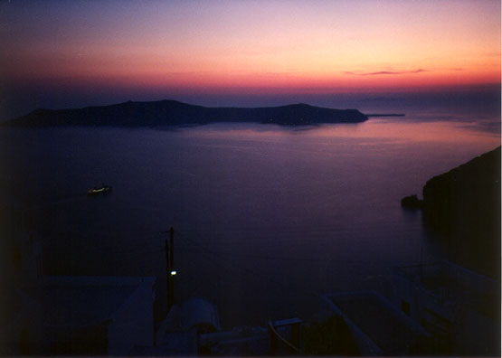 SANTORINI: We then flew to the island of Santorini (known in ancient times as Thera). Across the road from our hotel we looked down into the submerged caldera of the ancient volcano which may have given rise to the legend of Atlantis. You can go swimming in the warm waters heated by the caldera.