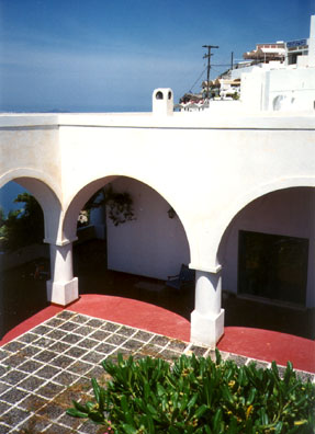 SANTORINI: We learned that we had been bumped from our hotel to the luxurious Santorini Palace Hotel, built in the style of the island's traditional architecture