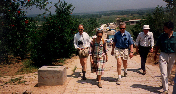 FIRST EMPEROR'S TOMB: The group follows Pete up the tomb mound.