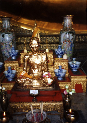 Prosperous worshippers can prove their piety by buying squares of gold leaf which are applied loosely to statues, a custom which leaves them looking like they are suffering from an acute skin disease.