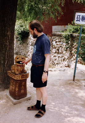 HUAQING TEMPLE: Me demonstrating proper use of a Chinese garbage can.