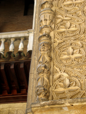 SEVILLA: Note the distinctly non-Muslim head carved in the framing decoration. A devout believer would avoid depicting the human form, especially in a public space such as this.