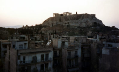 ATHENS: The next day, May 20, we were in Athens, via Olympic Airlines. From the rooftop of our hotel, The Athens Gate, we watched the sun set behind the Acropolis. The hotel was decent, though modest; one of its more attractive features being that it is placed near the Plaka (the traditional shopping district, packed with souvenir shops) and the Acropolis. But the view was spectacular.