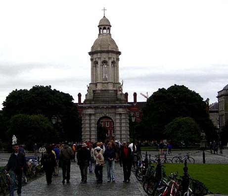 DUBLIN, TRINITY COLLEGE: One of the highlights of any Dublin tour is the campus of the distinguished Trinity College, an originally Protestant institution where many of the most famous figures in Irish arts and history have studied. Among writers, its students have included Jonathan Swift, Oliver Goldsmith, Oscar Wilde and Samuel Beckett (Joyce, however, studied at University College, Dublin, a Jesuit institution). The theater building is named after Beckett, and the visitor will note many other famous names affixed to rooms and buildings. The 19th-century Campanile at the center of campus; in the background, the oldest buildings on campus, the early 16th century Rubrics, now used as residence halls.