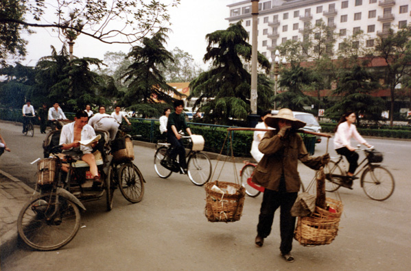 CHENG DU: Reading pedicab driver, waiting for a fare.