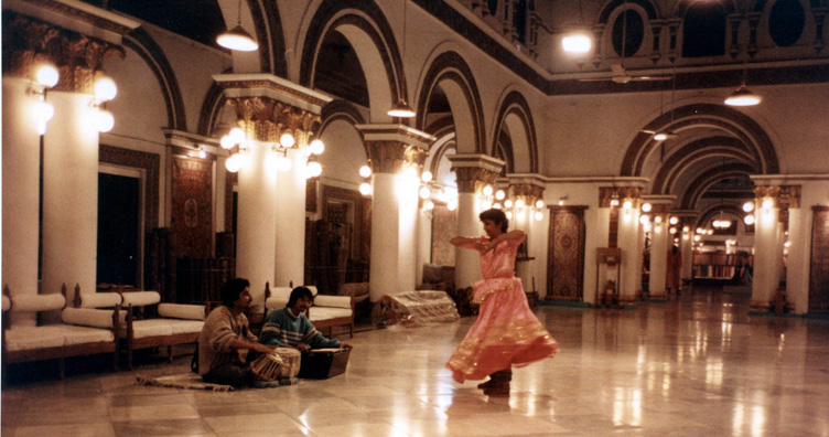 Tabla player, harmonium player, and dancer performing at a Kashmiri Rug emporium in a converted palace.