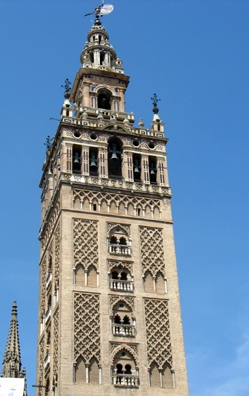 SEVILLA: The famed bell tower of the Sevilla Cathedral is composed of a Christian campanile built on top of a Moorish minaret (built 1184-1196). The sculpture on top, a figure depicting Faith, veers about with the wind, giving the tower its name: "La Giralda."