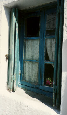 NAXOS: Bright blue paint sits on this window frame in Naxos.