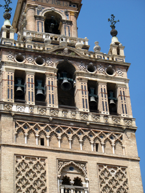 SEVILLA: The Moorish portion of the structure ends just below the bells. Open balconies were bricked up by the Christian architects.