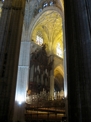 SEVILLA: Soaring Gothic pillars and arches frame the organ.
