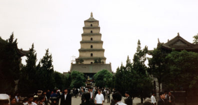 XANXI: Huge pagoda in Xanxi, on the way to the plane for Beijing. We had intended to take another train, but Mr. Cai, disappointed with our first one, got most of the money for the tickets refunded and bought us seats on a modern airplane. Instead we got an old Russian prop-plane that was cramped and noisy; but the attendants kept lavishing us with gifts: cookies, a sandalwood fan, drinks, etc.