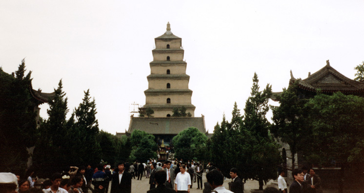 XANXI: Huge pagoda in Xanxi, on the way to the plane for Beijing. We had intended to take another train, but Mr. Cai, disappointed with our first one, got most of the money for the tickets refunded and bought us seats on a modern airplane. Instead we got an old Russian prop-plane that was cramped and noisy; but the attendants kept lavishing us with gifts: cookies, a sandalwood fan, drinks, etc.
