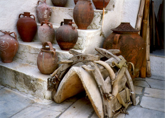 NAXOS: Pots and a donkey saddle.