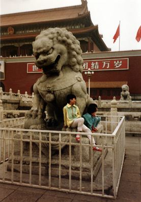 BEIJING: Kids on a lion sculpture in Tienanmin Square, near the entrance to the Forbidden City.
