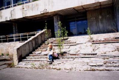 On the steps of the Palace of Culture; rather, on what remains of them.