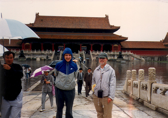 BWIJING: We made a hasty trip to the Forbidden City in the rain. Here are Tom and Terry in front of the building used as the backdrop in the opening scene of The Last Emperor.