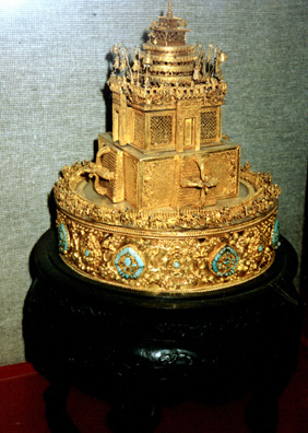 BEIJING: Intricate gold sculpture in Forbidden City. Many of the buildings are little-visited museums filled with art. One striking object, a huge sleeping mat for an emperor, is woven entirely of shredded ivory. I saw only a fraction of it all. The Forbidden City is enormous, sprawling, but no building is built on more than one story.