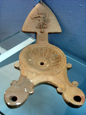 SEVILLA: The Roman version of a three-way lamp.In Sevilla Archaeological Museum.