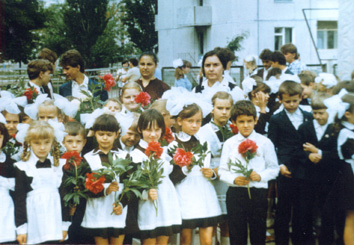 Sasha Sirota with his fellow pupils near school No 1 (He is the boy in the front row on the right, holding the flower.)