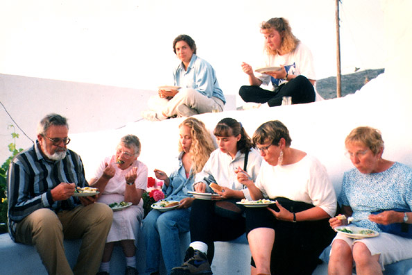 AMORGOS: Serious eating at Marcia's party (she's the one all dressed up, second from the right).