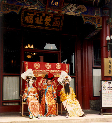 SUMMER PALACE: Tourists posing as members of the imperial court.
