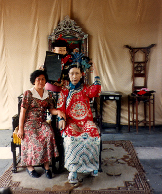 SUMMER PALACE: Tourists posing as members of the imperial court. (2)