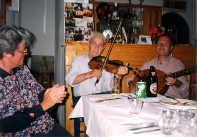 AMORGOS: That night Catherine had arranged a traditional roasted goat feast for us at Niko's taverna in Langatha (where earlier we had had a fabulous baked eggplant dish). Wonderful traditional music was provided by Stefanaiki (fiddle) and Michali (lauta).