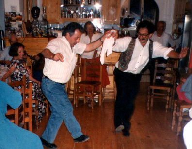 AMORGOS: On June 6 we spent much of the morning doing much-needed laundry, then relaxed at a wonderful beach around the corner from our hotel. This was the Feast of the Trinity, and we returned to Niko's for the evening's festivities, watching local families dance in the tiny space of of the crowded cafe. One man's outstretched arm swept Paul's glasses off his face! That's how close we were to the action. We went to bed at 3:00 AM. Niko and a friend doing a traditional dance