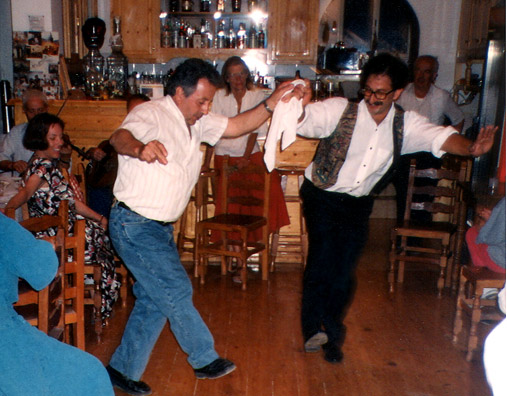 AMORGOS: On June 6 we spent much of the morning doing much-needed laundry, then relaxed at a wonderful beach around the corner from our hotel. This was the Feast of the Trinity, and we returned to Niko's for the evening's festivities, watching local families dance in the tiny space of of the crowded cafe. One man's outstretched arm swept Paul's glasses off his face! That's how close we were to the action. We went to bed at 3:00 AM. Niko and a friend doing a traditional dance