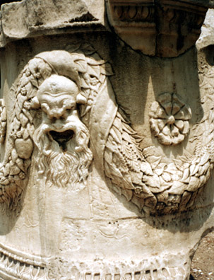 ATHENS: A carved comic mask on a Roman pillar