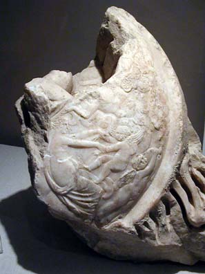 SELÇUK MUSEUM: His mother Aphrodite bounces one Eros on her lap while another reaches up. Multiple Erotes in the same image are fairly common in Classical art.