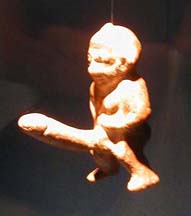 SELÇUK MUSEUM: But by far the most popular exhibit is the tiny image of the similarly well-endowed Bes. Unfortunately, the glass case enclosing him defeated the camera's auto-focus mechanism. Phallic images like this were very popular all over the ancient world, used as good-luck symbols.
