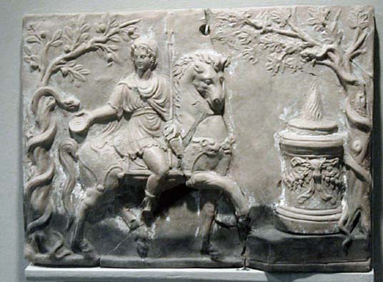 SELÇUK MUSEUM: This image shows the feeding of a sacred snake (pinax) by Hermes, holding his sacred wand (caduceus). Note the flame on the sacrificial altar to the right.