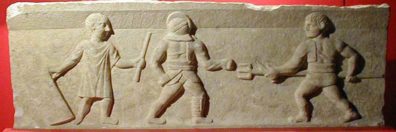 SELÇUK MUSEUM: Image from the tombstone of a gladiator. The Romans were entertained by combats involving differently armed (and protected) combatants like this.