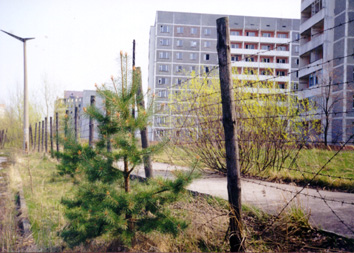 Behind the barbed wire