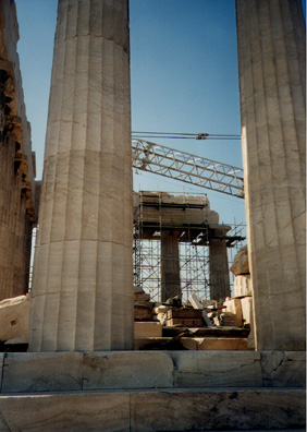 ATHENS: The cranes and scaffolds were present not so much to reconstruct the building as to undo earlier ruinous restorations. The exhaust fumes of Athens' automobiles and buses rapidly eat away the marble of this and other classical remains.