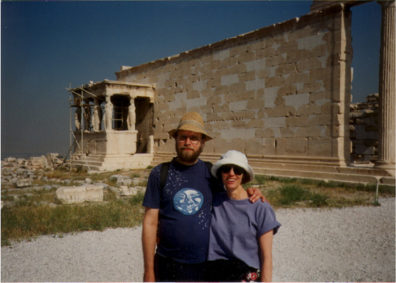 ATHENS: Paula and Paul in front of the Erectheum porch of the Caryatids (replicas--the original sculptures have been removed to a museum).