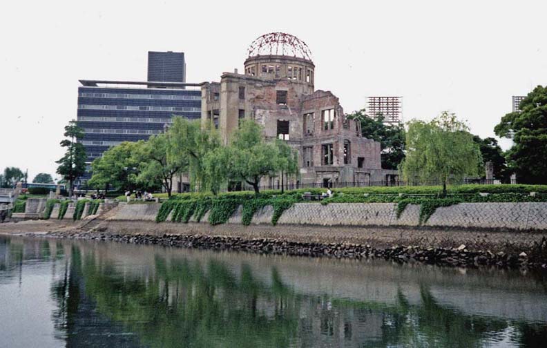 HIROSHIMA: This commercial exposition hall was the only reinforced concrete structure at ground zero, and was left standing after the dropping of the atomic bomb. It has become a symbol of the bombing, and has actually been "restored" to keep it in the precise state of ruin it was in 1945. Just to the right of the dome is visible a bank of lights for the adjacent baseball stadium. Hiroshima is a very modern city. May 17, 1998