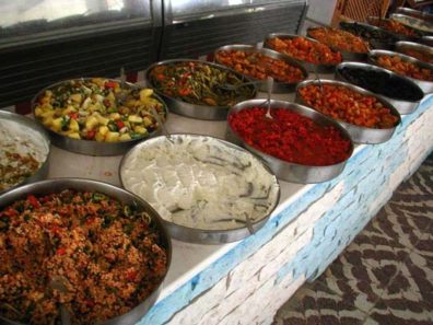 MILETUS: Our guide book warned about high-priced restaurants set up to serve tourist groups nearby. Lunch was included in the tour, so we don't know what it cost; but we would have gladly paid a handsome sum for this lavish spread. These are just a few of the delicious dishes offered at the huge buffet. That white stuff is garlicky sautéed green beans smothered in high-fat, high-density yogurt. Yum!